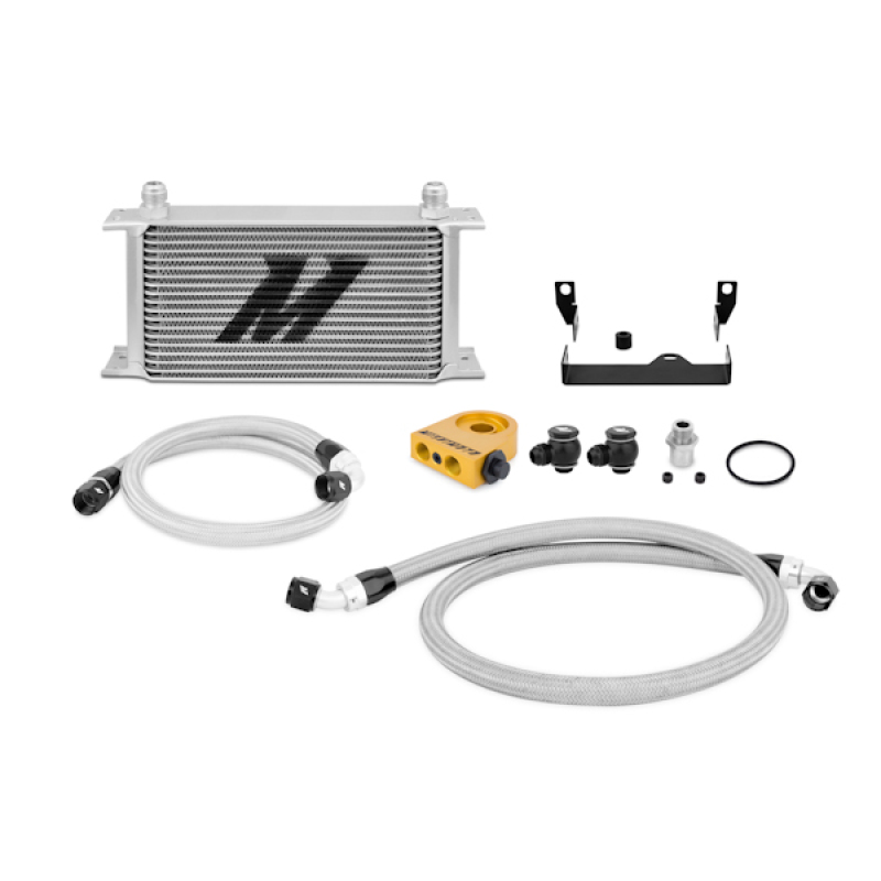 Mishimoto direct-fit oil cooler mounted behind the front bumper on a Subaru WRX