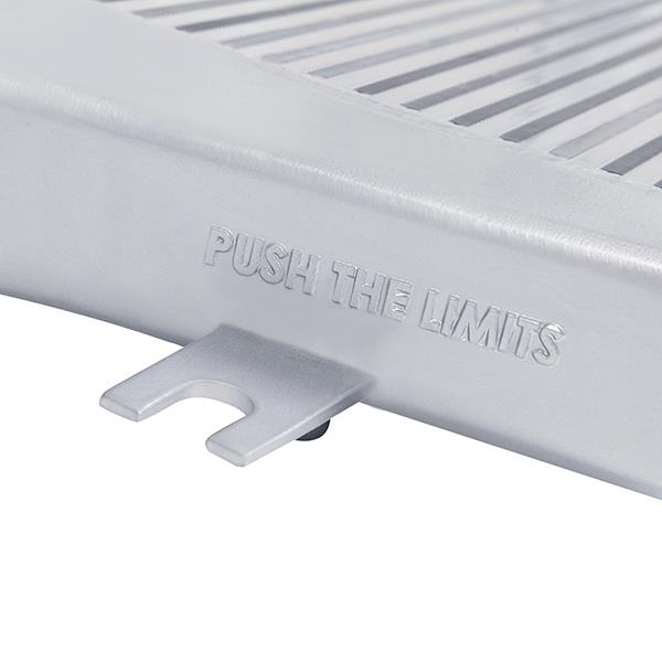 Mishimoto Cummins intercooler core showing bar-and-plate design and 3.66 inch inlet/outlet