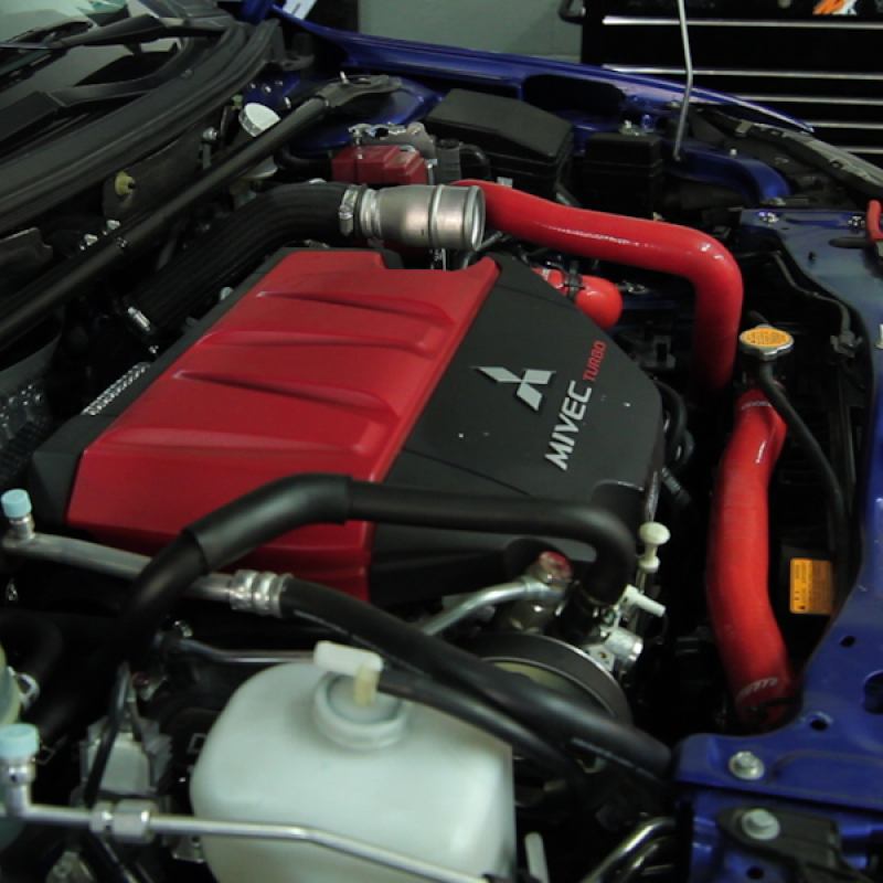 Red Mishimoto silicone radiator hoses rated to 330°F for Mitsubishi Evolution X