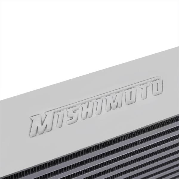 Mishimoto logo stamped on one side of the silver MMINT-UZ intercooler end tank