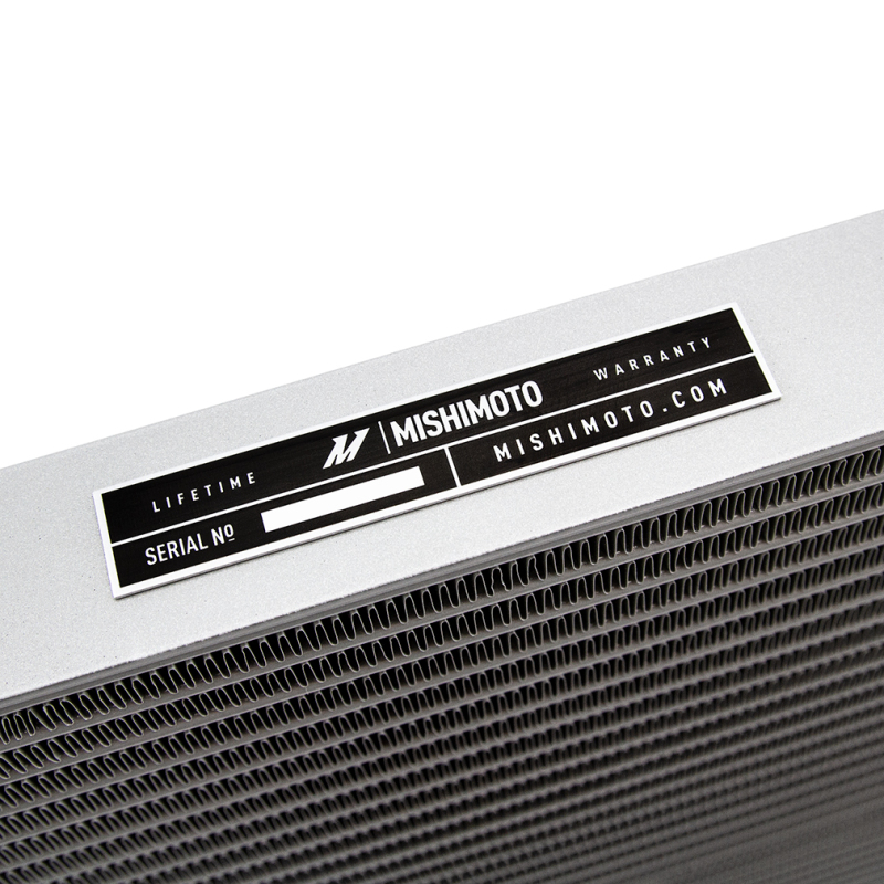 Close-up of Mishimoto branded silver transmission cooler part number MMTC-RAM-13SL