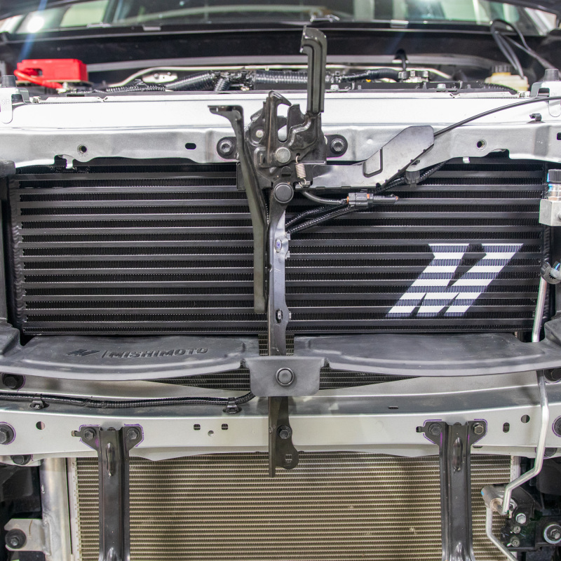 Mishimoto intercooler core showing 55% larger bar-and-plate design with cast end tanks
