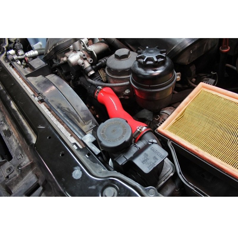 Close-up of Mishimoto red silicone hose material with embedded heat-resistant fibers