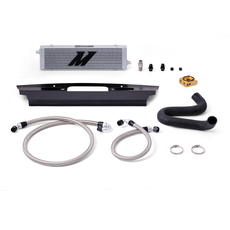 Sleek Silver Mishimoto oil cooler mounted in the upper grille of a Mustang GT for maximum airflow