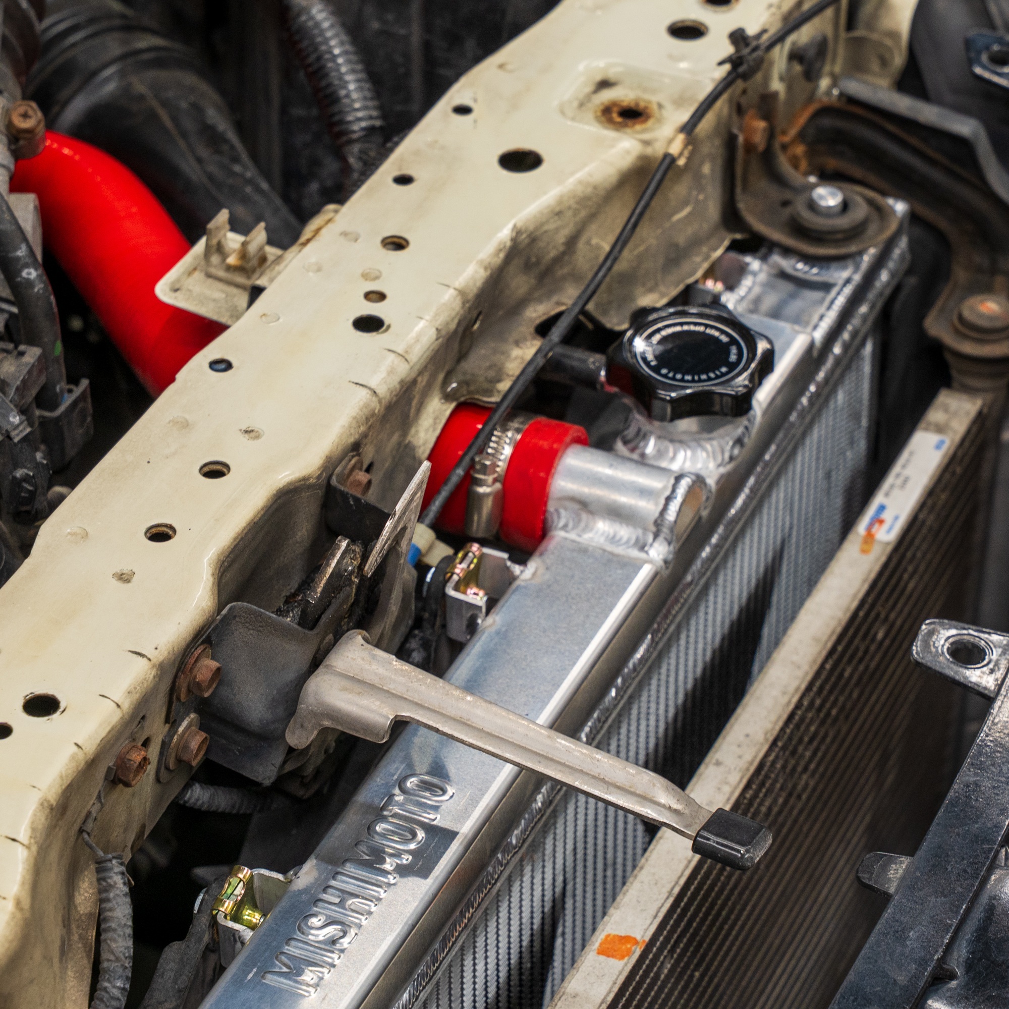 Red Mishimoto silicone radiator hoses and clamps included with Civic Si cooling kit