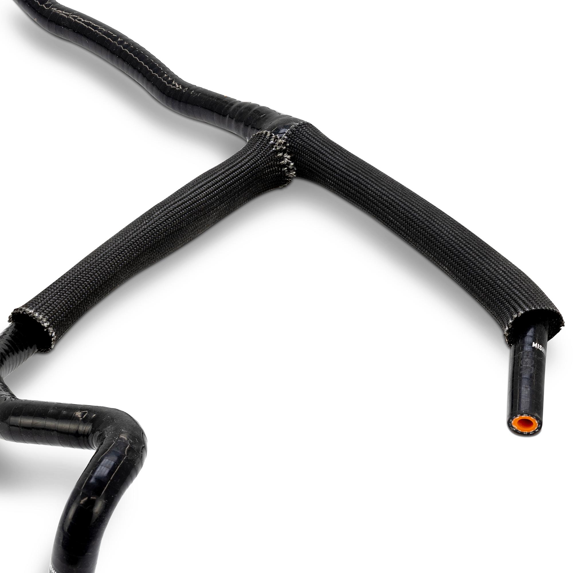Mishimoto silicone overflow hose with worm-gear clamps installed on Ford Super Duty