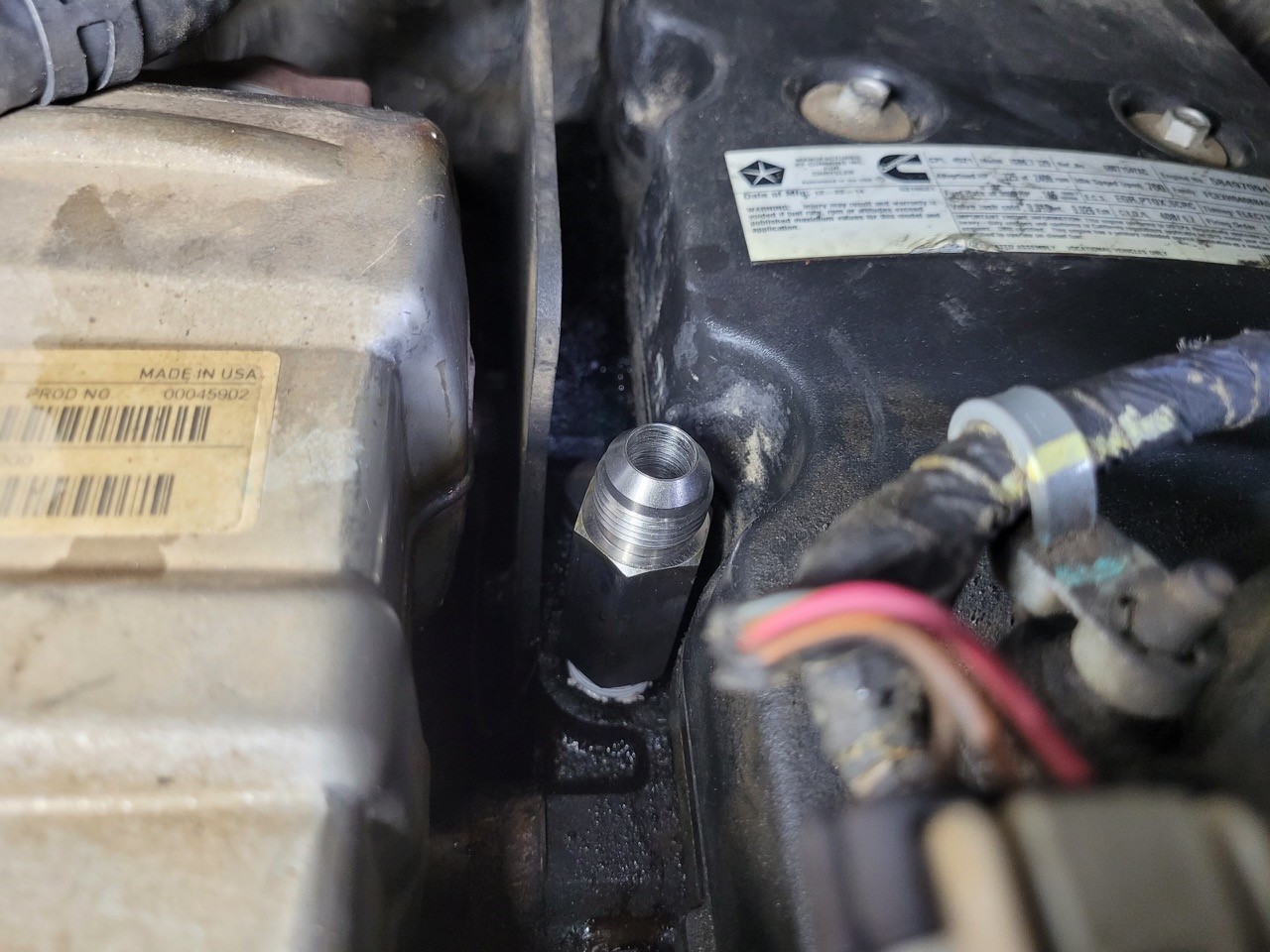 Mishimoto Top Heater Hose Upgrade fitting installed on RAM 6.7L Cummins engine