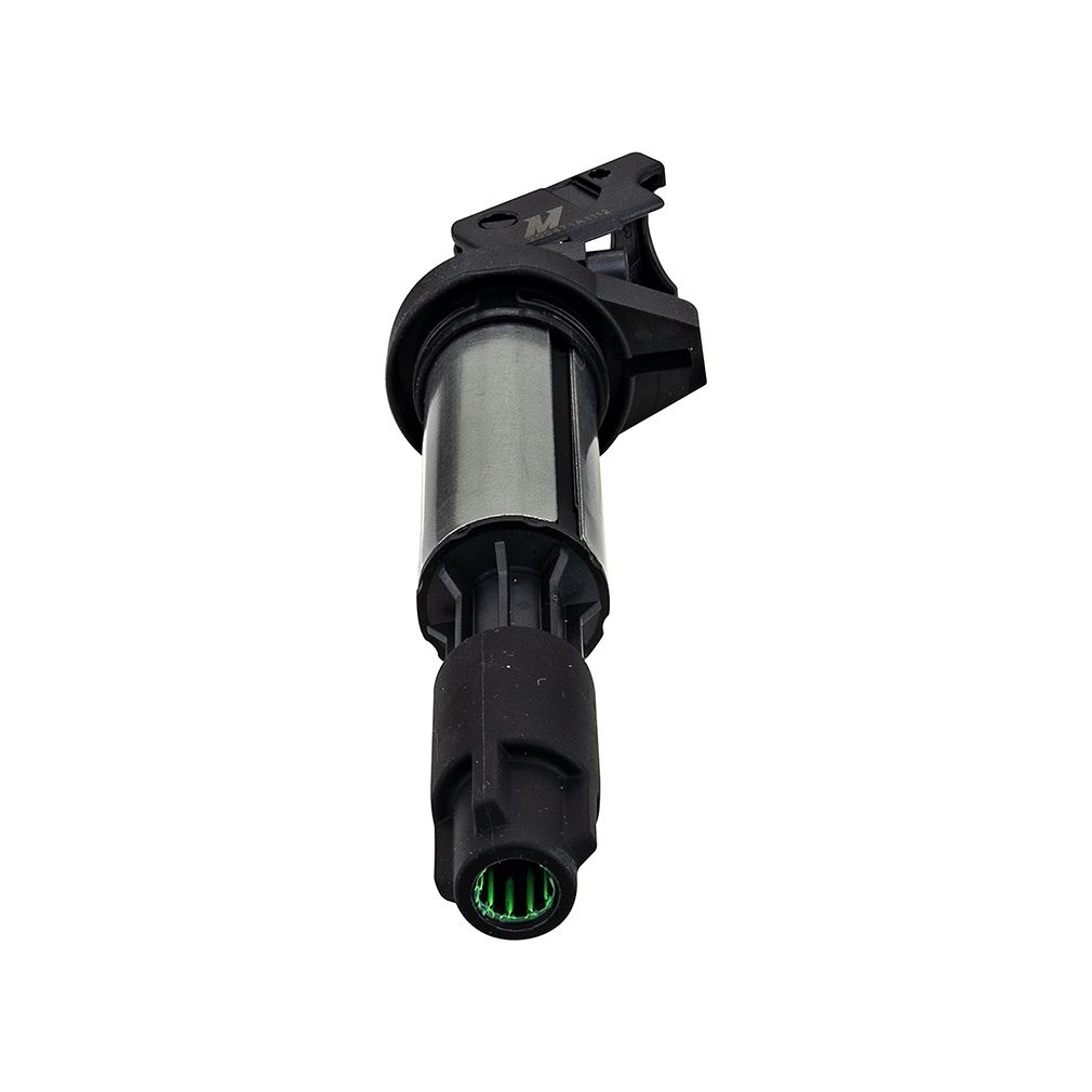 Mishimoto ignition coil shown next to spark plug for BMW ignition system replacement