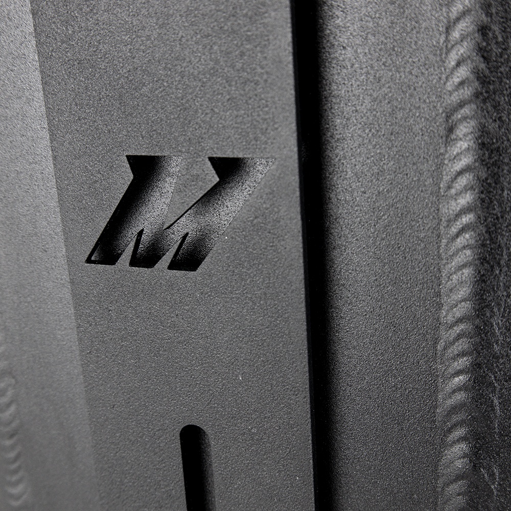 CNC-machined ribbed inlet and outlet couplers on Mishimoto forced induction intercooler core