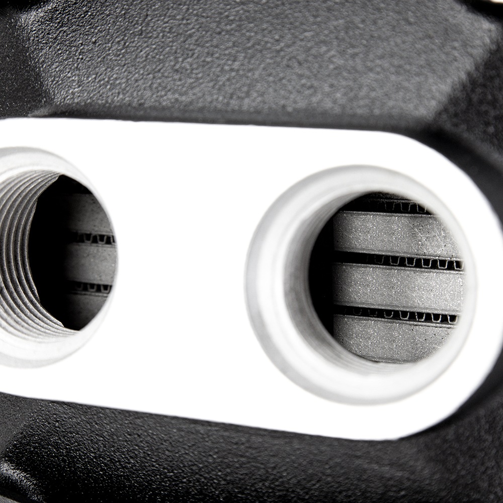 CNC-machined ribbed coupler connection on Mishimoto forced induction intercooler core