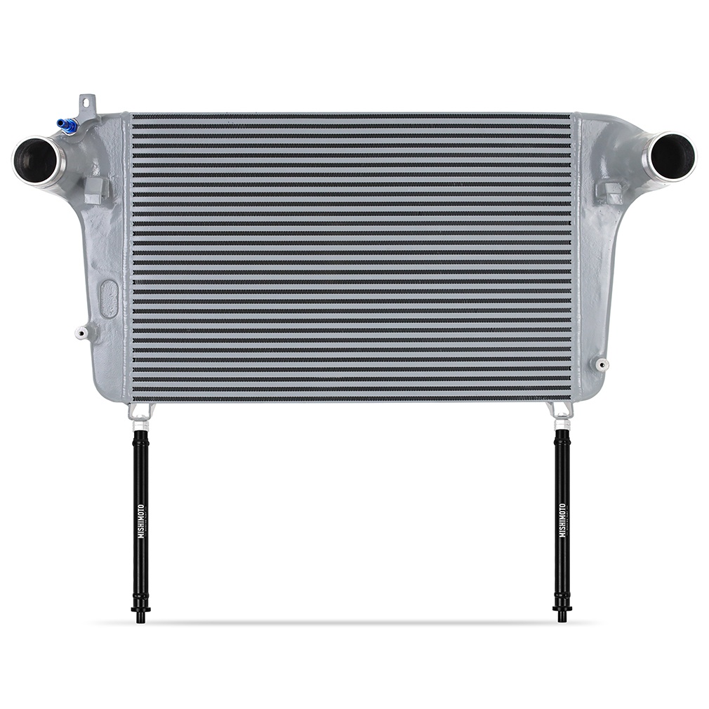 Mishimoto Explorer ST intercooler showing CNC-machined barbed inlet and outlet with silicone couplers