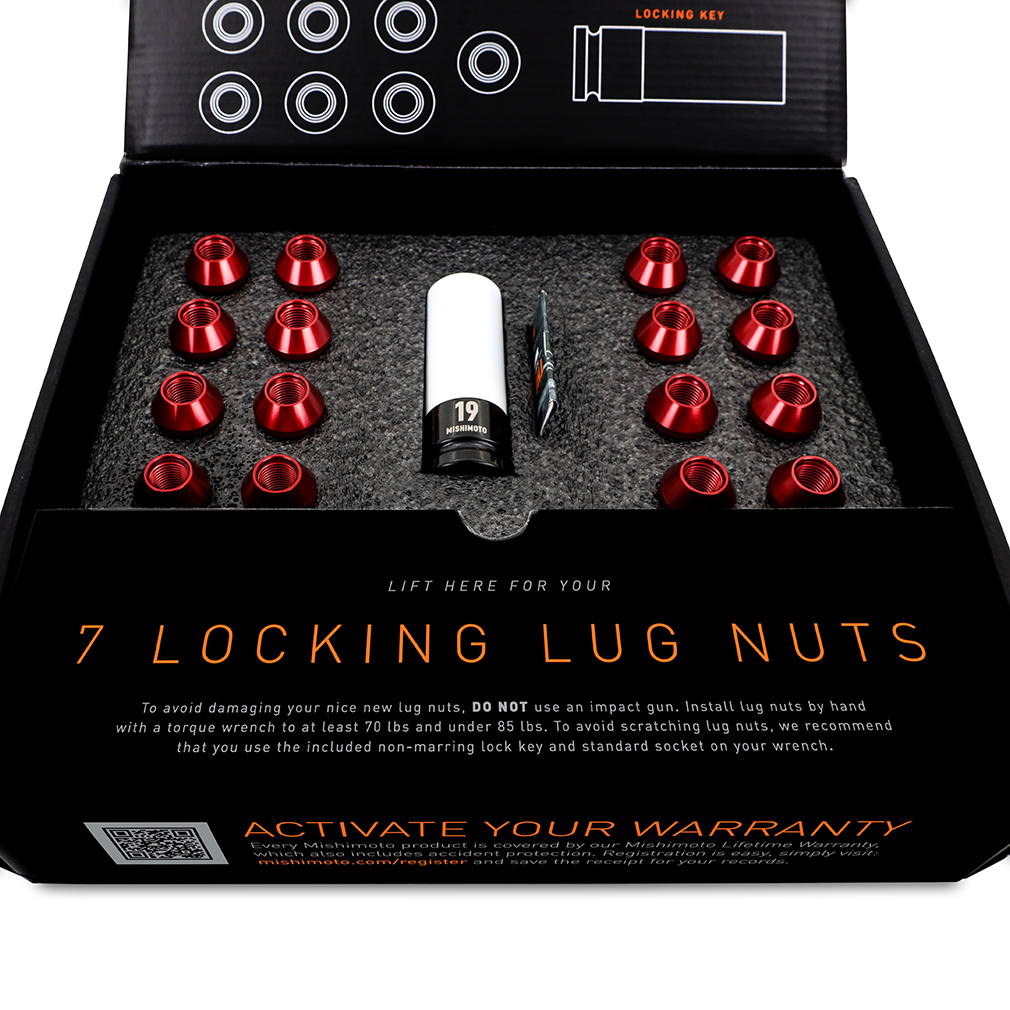 Mishimoto red locking lug nuts installed on aftermarket wheel with non-marring socket protection