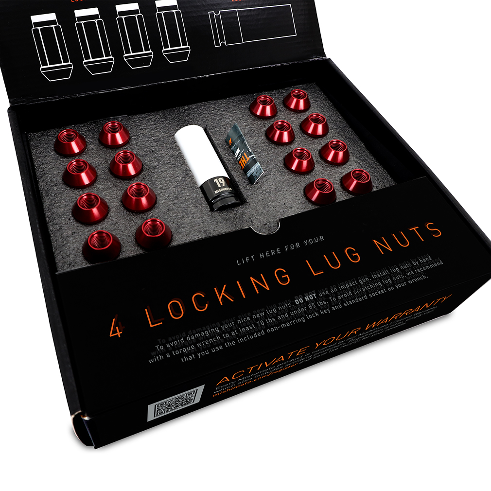 Full Mishimoto lug nut kit box contents laid out including tools and hardware