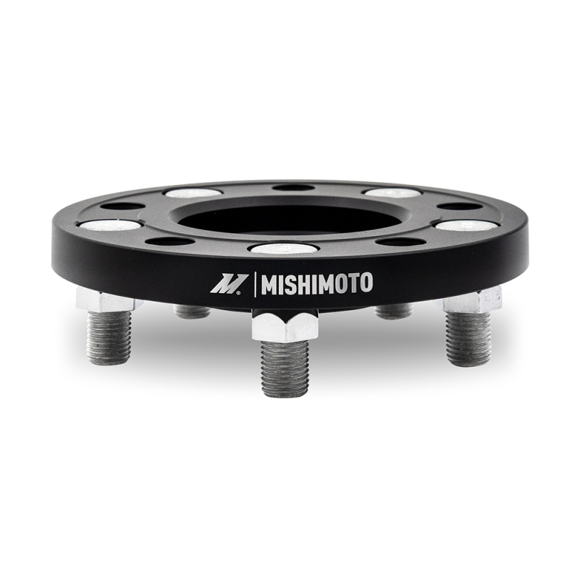 Close-up of Mishimoto wheel spacer bolt pattern 5x114.3 and 64.1mm center bore