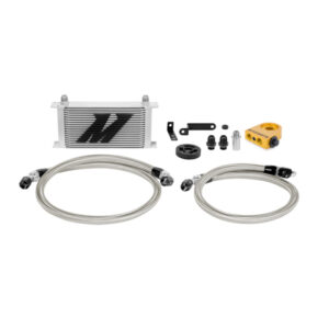 Mishimoto 19-row silver oil cooler kit installed in front bumper of a 2008-2014 Subaru WRX