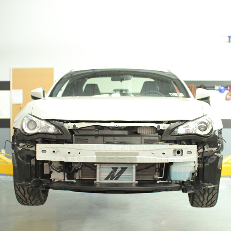 Mishimoto oil cooler kit installed in the front bumper of a Scion FR-S
