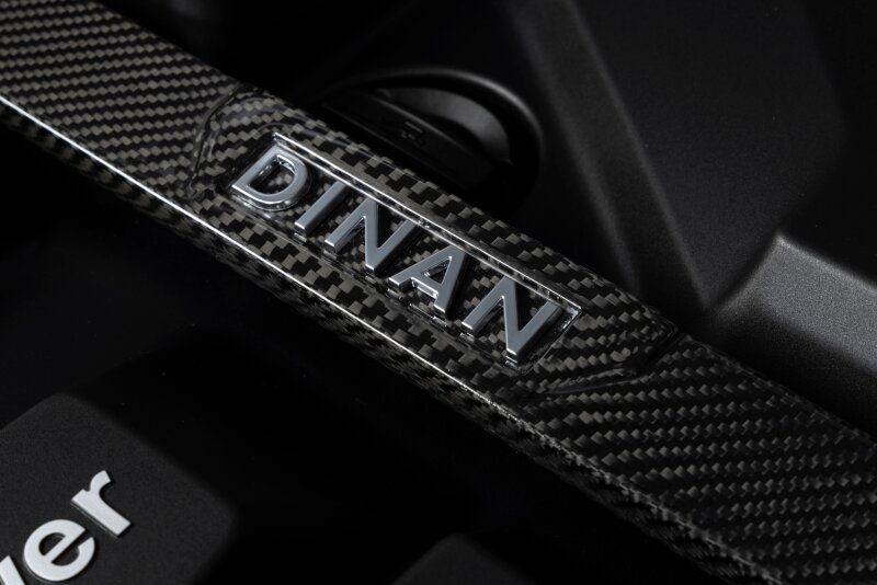 Close-up of Dinan D180-0015 carbon fiber strut tower brace